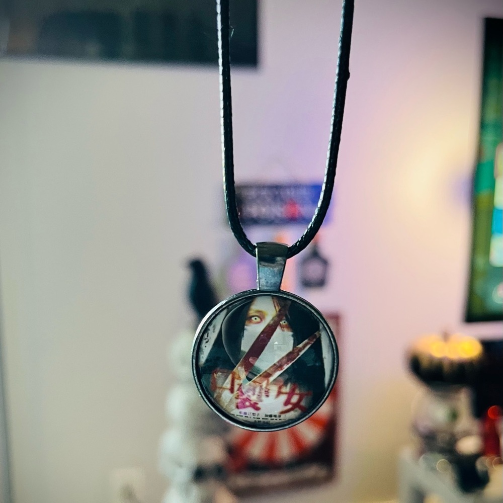 4/10 Japanese Horror Movie Necklace Carved: The Slit Mouth Woman
